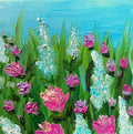 A 12”x12” square impressionistic painting of a flower meadow with pink roses and airy turquoise blossoms, green leaves, and a bright blue sky.  This original painting is by Canadian artist Louanne Ramage. An impressionistic painting of a wildflower meadow with vibrant pink and purple flowers, tall green grasses, and a bright blue sky background, rendered with thick textured paint strokes.