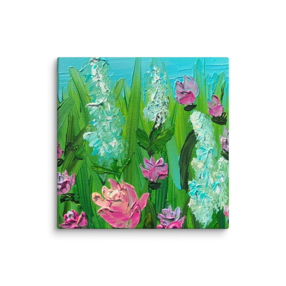 6”x6” A square museum quality canvas print with archival inks, featuring an impressionistic painting of a flower meadow with pink roses and airy turquoise blossoms, green leaves, and a bright blue sky, canvas shown against a plain white background.  Original painting of this print is by Canadian artist Louanne Ramage.